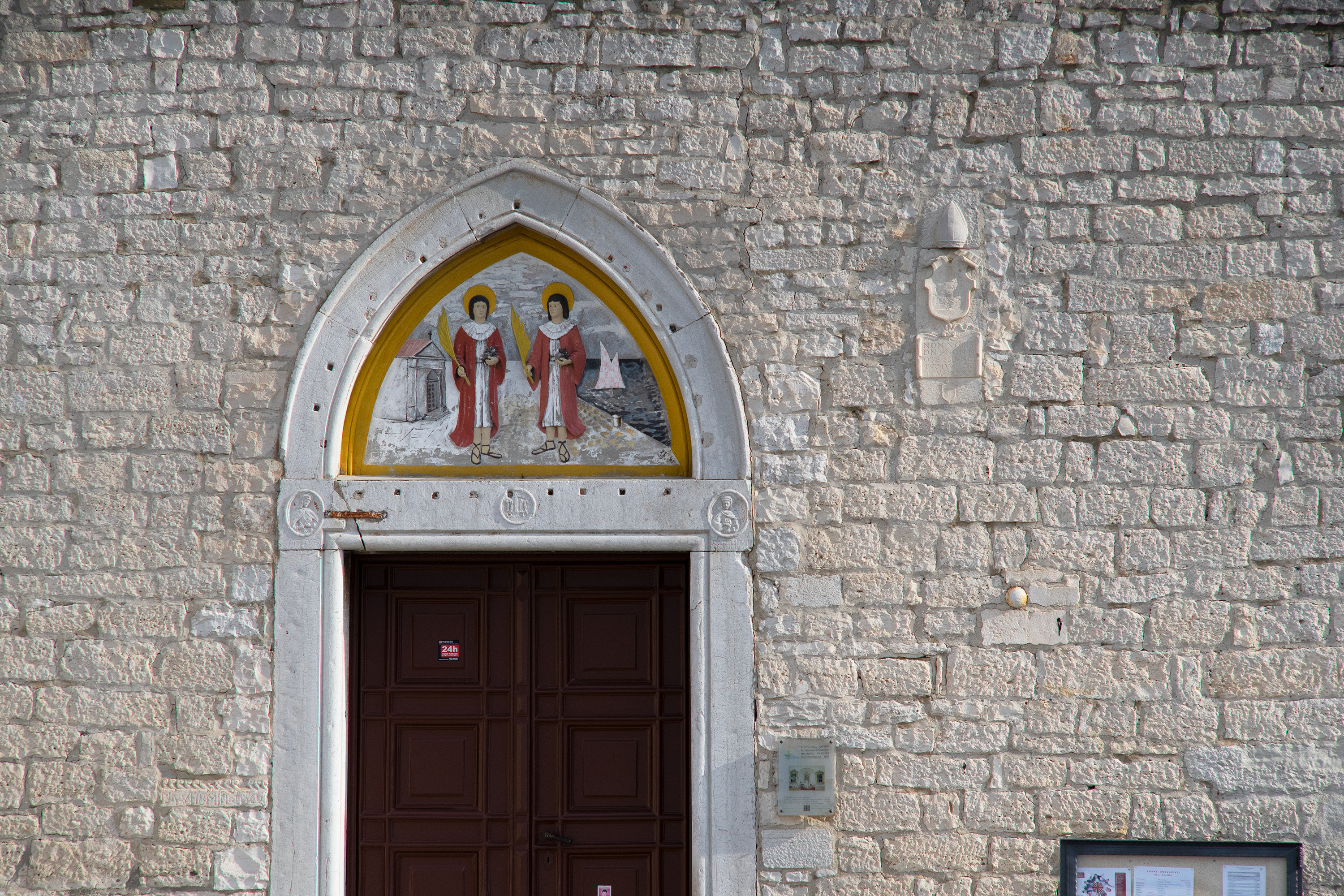 A beautiful image of church brick wall with a golden arch. Creative Commons